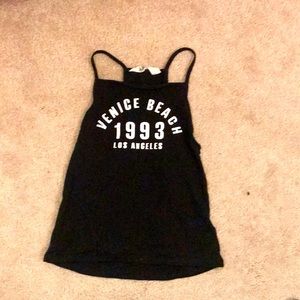 Black tank top by H&M. Made in Bangladesh. Size 8-10Y.